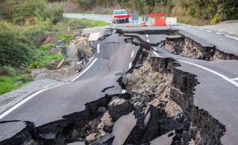A road that has been destroyed by an earthquake A road that has been destroyed by an earthquake